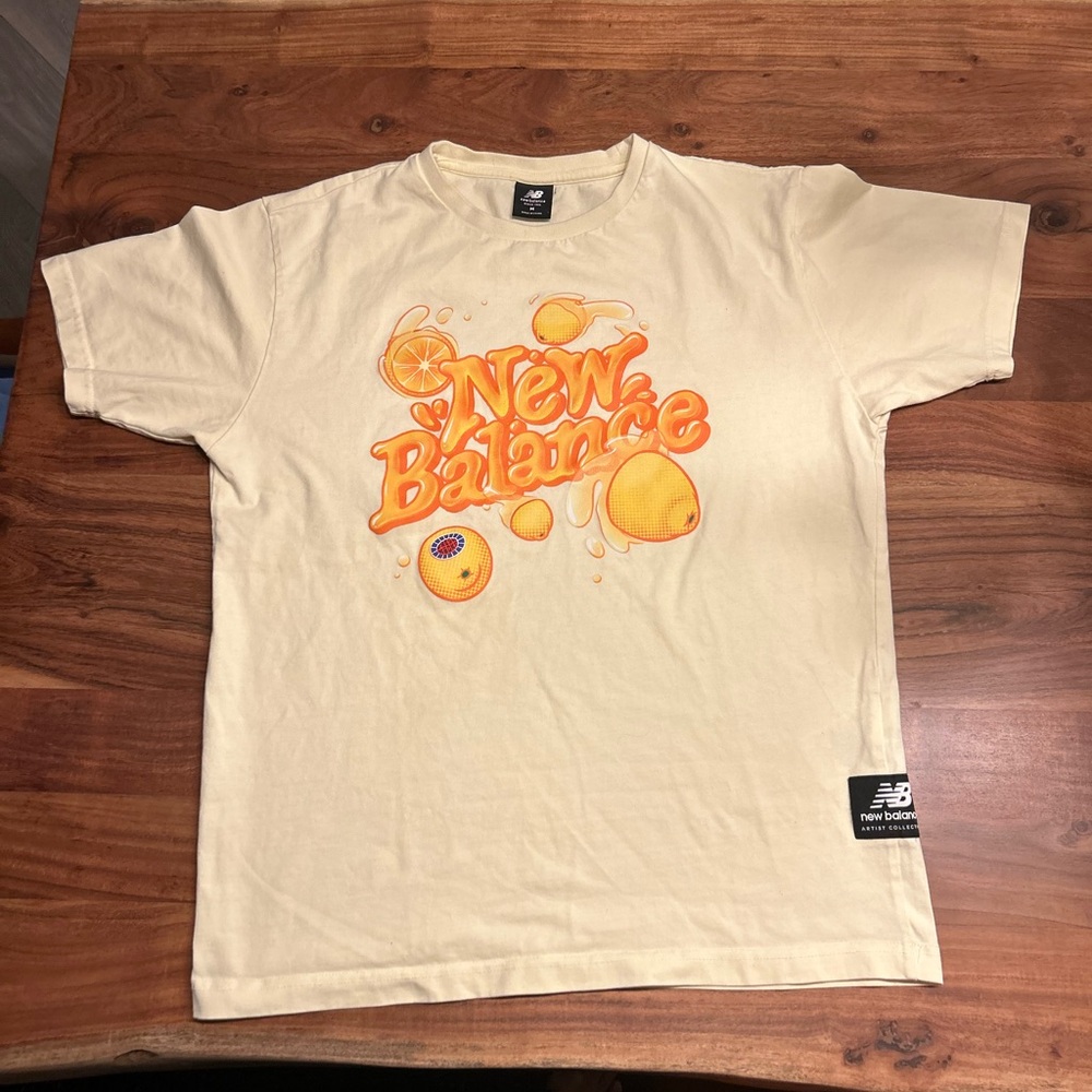 New Balance Yellow Graphic Tee with Orange Print